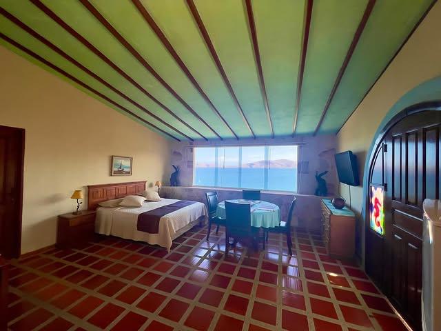 Posada Iguanazul Suites background