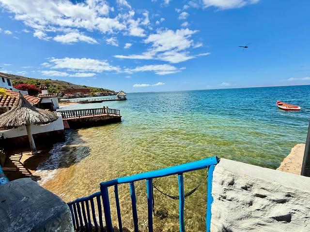 Ocaso Casa de Playa background